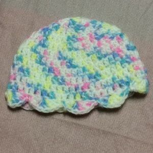 Pastel rainbow baby hat with ruffle fringe